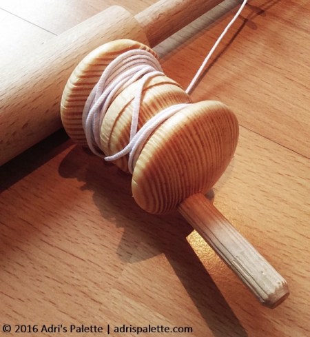 The original tutorial called for a wooden spool and two discs to make the reel. I opted for two wooden door nobs that I glued together. I think it makes one spiffy reel!